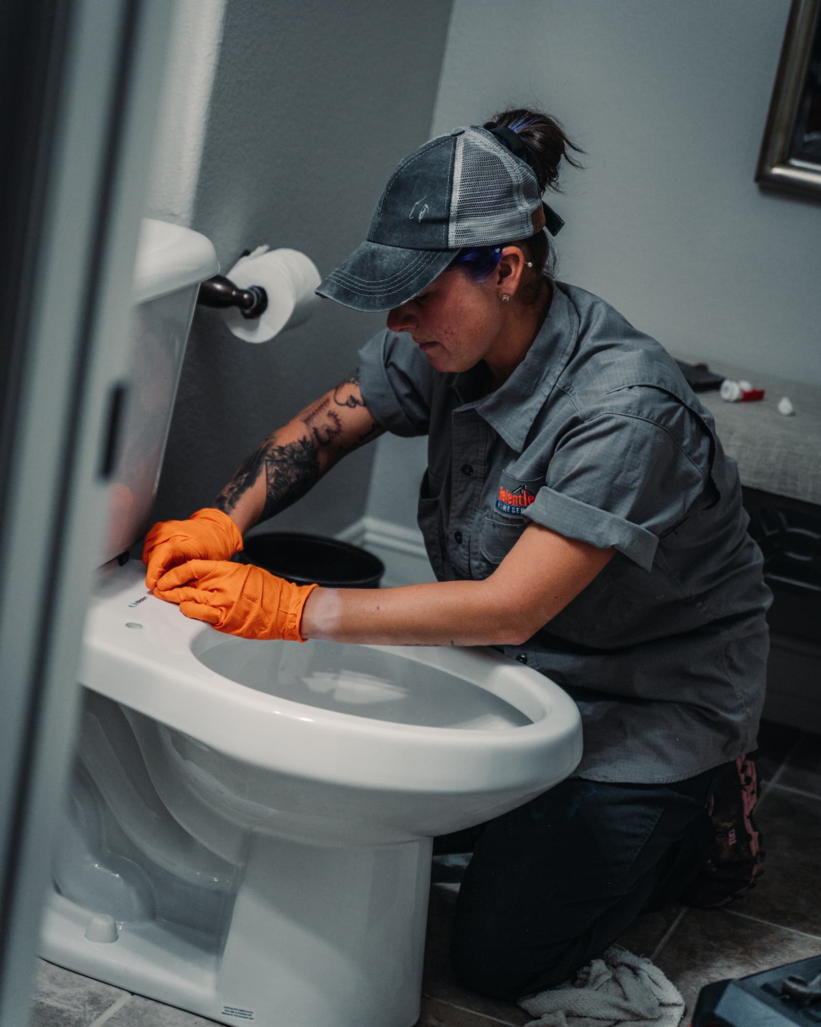 Relentless Plumbing Solutions technician servicing a home