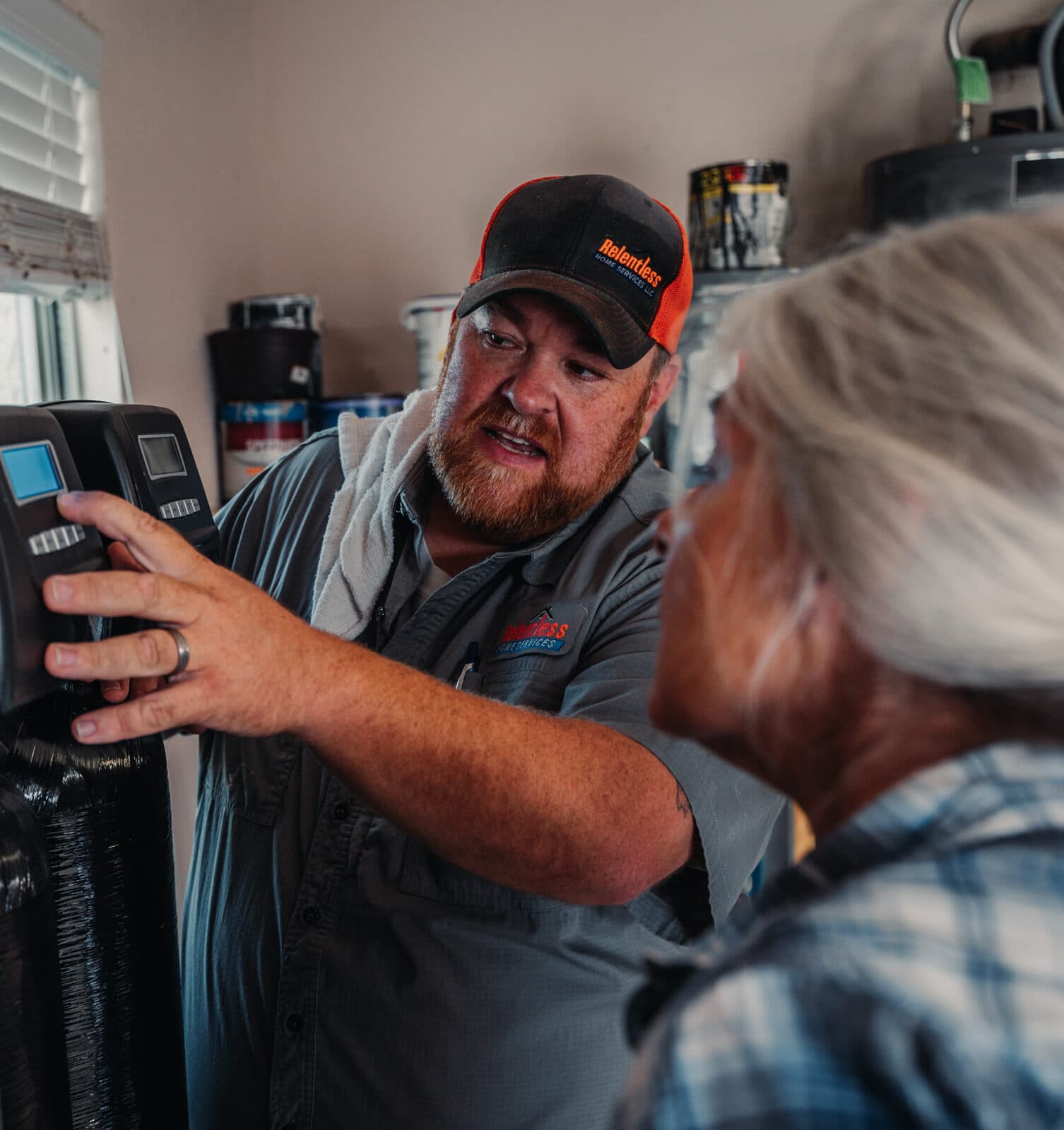 Relentless Plumbing Solutions technician installing water filtration system